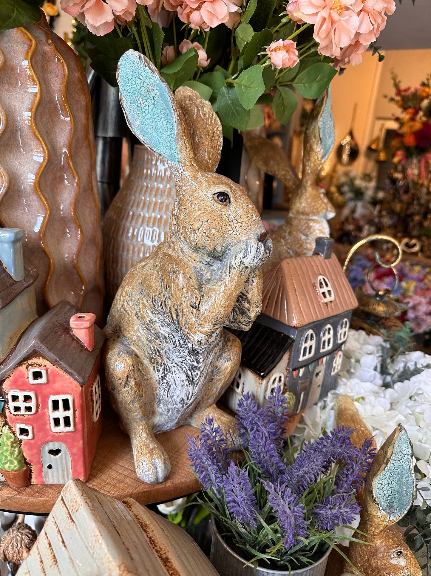 Decorative Rabbit with Paws on Mouth